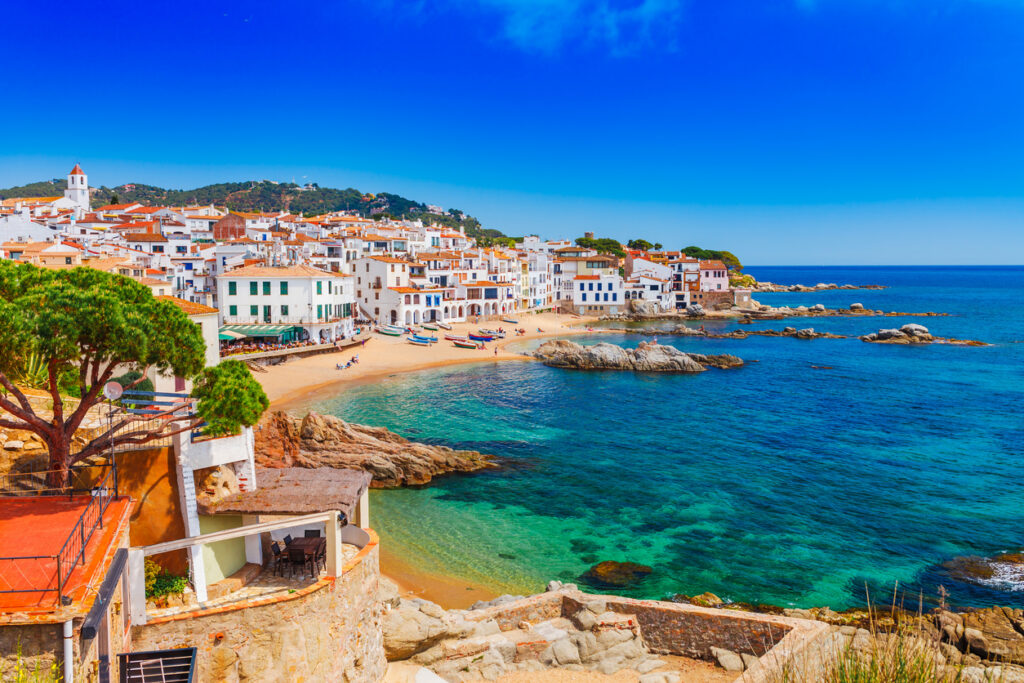 Sea landscape with Calella de Palafrugell, Catalonia, Spain near of Barcelona. Scenic fisherman village with nice sand beach and clear blue water in nice bay. Famous tourist destination in Costa Brava